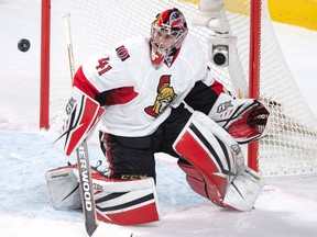 Ottawa Senators' goalie Craig Anderson keeps his eyes on the puck as he deflects a shot from the Montreal Canadiens during second period NHL hockey action, in Montreal, on Tuesday, Nov. 3, 2015. THE CANADIAN PRESS/Paul Chiasson