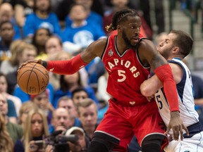 Dallas Mavericks guard J.J. Barea (right) defends against Toronto Raptors forward DeMarre Carroll at the American Airlines Center Tuesday. (Jerome Miron/USA TODAY Sports)