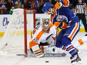 Edmonton forward Teddy Purcell (16) is stopped by Philadelphia goaltender Michal Neuvirth (30) during the first period of a NHL game between the Edmonton Oilers and the Philadelphia Flyers at Rexall Place in Edmonton, Alta. on Tuesday November 3, 2015. Ian Kucerak/Edmonton Sun/Postmedia Network