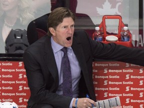 Toronto Maple Leafs' head coach Mike Babcock calls out instructions from the bench as his players face the Montreal Canadiens during first period NHL pre-season hockey action Sept. 22, 2015, in Montreal. Hockey Canada is expected to name its coaching staff for the 2016 World Cup of Hockey on Nov. 5, 2015, in Toronto. Babcock is expected to be named head coach after leading Canada to gold medals at the 2010 and 2014 Olympics. (PAUL CHIASSON/The Canadian Press files)