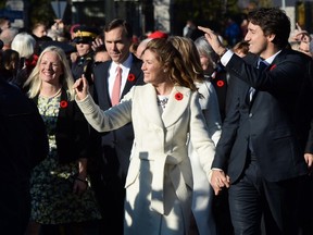 Justin Trudeau and his wife Sophie Gregoire-Trudeau lead the new Liberal cabinet to Rideau Hall in Ottawa on Wednesday, Nov. 4, 2015. THE CANADIAN PRESS/Sean Kilpatrick