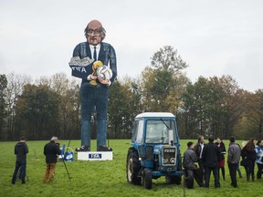 A giant effigy of the suspended president of FIFA Sepp Blatter created by British artist Frank Shepherd of the Edenbridge Bonfire Society is erected for a photo call in Edenbridge, Kent, southeast England, on November 4, 2015 before it is exploded and burned at this year's Bonfire Night celebrations. The Edenbridge Bonfire Society has been making fun of public figures for 20 years by building and exploding a second 'celebrity Guy' effigy alongside their traditional figure of Guy Fawkes as part of the Bonfire Night celebrations in the town. Blatter was suspended from his role as FIFA president in October 2015 by FIFA's independent ethics committee for 90 days as part of a wide-ranging investigation into corruption at the heart of world football's governing body. AFP PHOTO / JACK TAYLOR