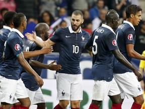 France's Karim Benzema (C) celebrates after scoring during their friendly soccer match against Armenia at Allianz Riviera stadium in Nice, France, October 8, 2015.  REUTERS/Eric Gaillard