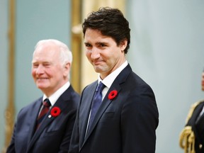Justin Trudeau stands with Governor General David Johnston before being sworn-in as Canada's 23rd prime minister during a ceremony at Rideau Hall in Ottawa November 4, 2015. REUTERS/Chris Wattie