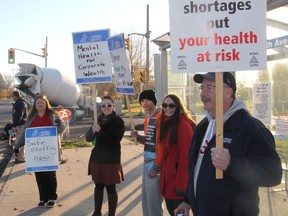 Members of OPSEU who work at the Providence Care Mental Health Services site in Kingston, Ont. hold an information picket in front of the hospital on Wednesday, Nov. 4, 2015 to protest what they say are dangerous working conditions. Michael Lea/The Whig-Standard/Postmedia Network