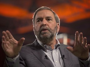 NDP Leader Tom Mulcair addresses supporters at a campaign event in Toronto on October 5, 2015. Mulcair, who has remained out of the public eye since the election, met his caucus on Parliament Hill on Wednesday. THE CANADIAN PRESS/Ryan Remiorz