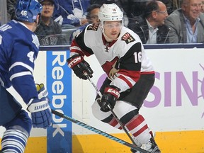 Max Domi #16 of the Arizona Coyotes skates with the puck against the Toronto Maple Leafs during an NHL game at the Air Canada Centre on October 26, 2015 in Toronto, Ontario, Canada. The Coyotes defeated the Leafs 4-3.   Claus Andersen/Getty Images/AFP