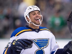St. Louis Blues right winger Ryan Reaves celebrates after defeating the Dallas Stars at the American Airlines Center in Dallas on April 3, 2015. (Jerome Miron/USA TODAY Sports)
