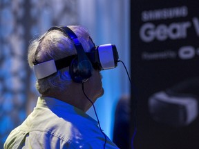 A guest uses a Gear VR virtual reality headset during a preview session in Hollywood, California September 24, 2015. Oculus and Samsung Electronics unveiled a new version of Gear VR virtual reality headset for $99, half the price of the previous "Innovator Edition", and said the product would be available in the United States in time for Black Friday and globally shortly after.  REUTERS/Mario Anzuoni
