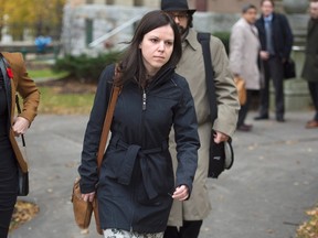 Tara Gault, alleged to have assaulted Environment Minister Andrew Younger, heads from provincial court in Halifax on Wednesday, Nov. 4, 2015. Gault's case was dismissed after Younger exercised his legislative privilege not to appear. THE CANADIAN PRESS/Andrew Vaughan