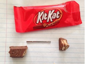 Niagara Regional Police photo of a razor blade found in a chocolate bar handed out at Halloween. There have been eight cases of tainted candy discovered in southern Ontario. (Niagara Police/Handout/Postmedia Network)