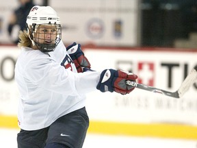 Former Team USA defenceman Angela Ruggiero shoots during practice at the MTS Centre in this file photo. (Jason Halstead, Winnipeg Sun)