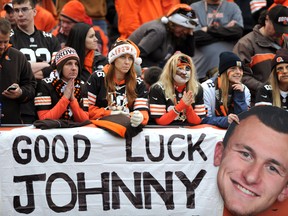 Fans in the Dawg Pound with Johnny Manziel signage during the game between the Cleveland Browns and the Cincinnati Bengals at FirstEnergy Stadium in Cleveland on Dec. 14, 2014. (Ken Blaze/USA TODAY Sports)