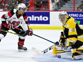 Ottawa 67’s Jeremiah Addison is stopped by Kingston Frontenacs goaltender Lucas Peressini during an Ontario Hockey League game at the Canadian Tire Centre in Ottawa on Wednesday. The Frontenacs lost 2-1. (Errol McGihon/Postmedia Network)