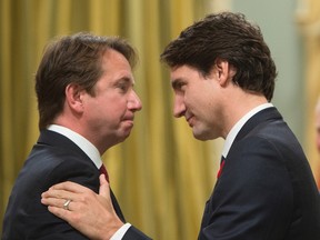 Prime Minister Justin Trudeau congratulates Scott Brison as he is sworn in as President of the Treasury Board during a ceremony at Rideau Hall in Ottawa on Wednesday, November 4, 2015. THE CANADIAN PRESS/Sean Kilpatrick