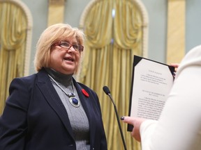 Canada's new Employment Workforce Development and Labour Minister MaryAnn Mihychuk is sworn-in during a ceremony at Rideau Hall in Ottawa November 4, 2015. AFP PHOTO/POOL/CHRIS WATTIE