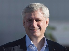 Conservative Leader Stephen Harper smiles as he arrives in Toronto, Sunday, Oct. 11, 2015. On his final day as prime minister, Harper reached out to a public service which his government had a tense relationship with for the last nine years.In a message sent to the entire government bureaucracy, he thanks them for the support they've shown his team over three successive Parliaments and for their dedication to the well-being of Canadians. THE CANADIAN PRESS/Jonathan Hayward