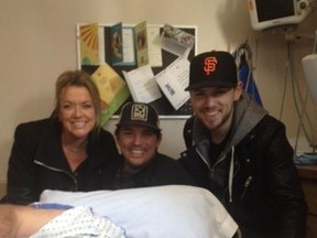 Country star Brett Kissel (right), along with QX104 morning hosts Brody Jackson and Samantha Stevens, made a surprise hospital visit to Derek McLennan last week.