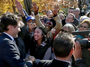 Prime Minister Justin Trudeau greets some of the thousands of people who came to see him outside at Rideau Hall in Ottawa on Wednesday, Nov. 4, 2015. Tony Caldwell/Ottawa Sun/Postmedia Network