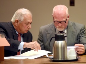 Suspended correction officer Gene Palmer, right, accused of inadvertently helping two killers escape from Clinton Correctional Facility in Dannemora, N.Y., with his lawyer William Dreyer, waived his right to have his case heard by a grand jury and pleaded not guilty to charges Wednesday Nov. 4, 2015 in Clinton County Court in Plattsburgh. Palmer now faces a felony charge in connection with hamburger containing hacksaw blades that he allegedly delivered to an inmate that escaped from Clinton Correctional a few days later. (Rob Fountain/Press-Republican via AP)