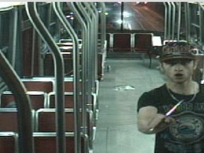 Sammy Yatim holds a knife while on a streetcar in Toronto on July 27, 2013 in this still taken from court handout surveillance video.