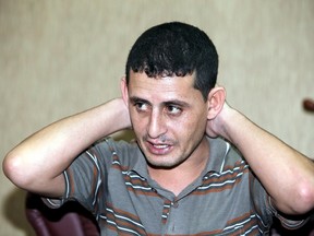 Saad Khalaf Ali, one of the 69 hostages rescued from an Islamic State prison in a joint raid by U.S. and Kurdish special forces, speaks during an interview with Reuters in Erbil, Iraq, October 29, 2015. Reuters interviewed three of the rescued hostages at a security facility in the Kurdish regional capital Erbil. The men recounted their experiences of life under Islamic State rule, and the physical and psychological torment that often comes with it. Many of the prisoners were former members of the Iraqi security forces who fought some of the same insurgents before the militants overran a third of Iraq. Reuters could not independently verify the accounts. Picture taken October 29, 2015. REUTERS/Azad lashkari