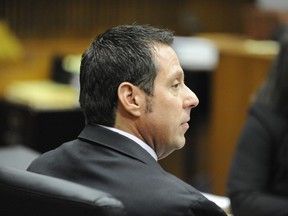Former Inkster police officer William Melendez sits in Judge Vonda Evans' courtroom at the Frank Murphy Hall of Justice in Detroit on the first day of his trial on Wednesday, Nov.4, 2015.  He is charged with beating African-American motorist Floyd Dent during a January traffic stop that's on video. Melendez, who was fired, is charged with assault. (David Coates, The Detroit News via AP)