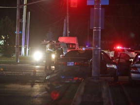Police remain at the scene of a four-car collision at the intersection of Princess Street and Bayridge Drive Wednesday evening. (Elliot Ferguson/The Whig-Standard)