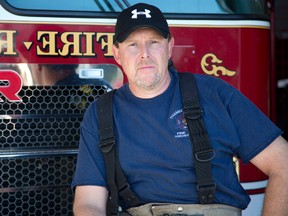 Volunteer firefighter Tim Churchill was the first to arrive at house fire at 146 Elgin Road in Thames Centre Ont. on Tuesday November 3, 2015 where he was told a person was trapped inside. Wearing only his street clothes he entered and exited the building several times before locating an unconscious woman and carried her outside. " (I) was just in my street clothes, which probably wasn't the smartest thing to do, but sometimes you've got to do what you've got to do," he said of his heroic yet ill-advised actions. He was taken to hospital with smoke inhalation and released the same day. Unfortunately attempts to revive the woman were unsuccessful. Photo shot on November 4. (DEREK RUTTAN, The London Free Press)