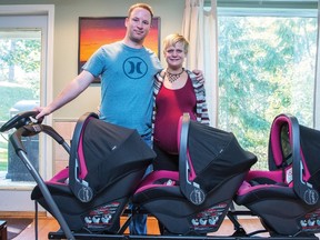 Mahalia Meeuwsen and her husband Mike show off their new stroller, nicknamed the "train" for their expected identical triplet girls, in Salmon Arm, B.C. THE CANADIAN PRESS/HO-Salmon Arm Observer- Evan Buhler