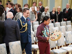 Cree drummer Theland Kicknosway leads the procession into Rideau Hall before Justin Trudeau is sworn-in as Canada's 23rd prime minister during a ceremony  in Ottawa November 4, 2015. The 12-year-old lives in Ottawa but has roots in Walpole Island. (REUTERS/Chris Wattie)