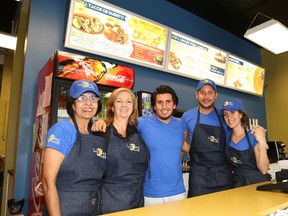 Rosaura Ortega, left, Guadalupe Luna de Siller, Carlos Siller Jr., Ariel Gonzalez and Paulina Siller-Luna, of Taco Sol, were busy during the grand opening of the downtown restaurant on Cedar Street. John Lappa/Sudbury Star