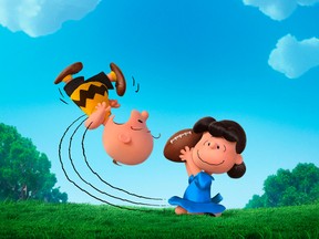 In this photo provided by Twentieth Century Fox & Peanuts Worldwide LLC, Charlie Brown and Lucy play in the new film, "The Peanuts Movie." (Twentieth Century Fox & Peanuts Worldwide LLC via AP)