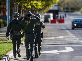 Merced County Sheriff SWAT members enter the University of California, Merced campus after a reported stabbing in Merced, Calif., Wednesday, Nov. 4, 2015. An assailant stabbed five people on the rural university campus in central California before police shot and killed him, authorities said Wednesday.  (Andrew Kuhn/Merced Sun-Star via AP)