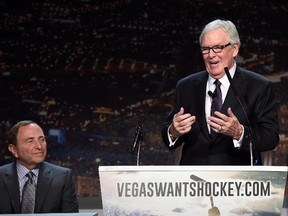 NHL commissioner Gary Bettman looks on as Fidelity National Financial Inc. president of Hockey Vision Las Vegas Bill Foley speaks during a news conference at the MGM Grand Hotel & Casino in Las Vegas on Feb. 10, 2015. (Ethan Miller/Getty Images/AFP)