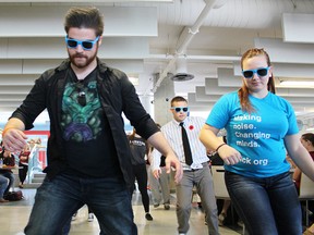 Nathan Holtz, Kyle McVittie and Lisa McCormick dance during a flash mob at Lambton College Thursday. The event was one of several stress relievers during the college's annual Unleash the Stress week, designed to help students contending with mid-terms relax. (Tyler Kula, The Observer)