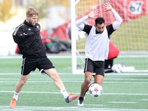 Ottawa Fury FC captain Richie Ryan, left, trains with teammate Paulo Jr. at TD Place on Thursday, Nov. 5, 2015. (Chris Hofley/Ottawa Sun)