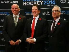 Doug Armstrong, Team Canada general manager (L) and Tom Renney, Hockey Canada’s president and CEO, announced  Mike Babcock (middle) will coach Canada at the World Cup of Hockey 2016. (Jack Boland/Toronto Sun/Postmedia Network)