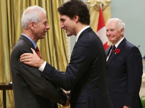Prime Minister Justin Trudeau congrats Minister of Foreign Affairs Stephane Dion during a swearing-in ceremony at Rideau Hall in Ottawa November 4, 2015. REUTERS/Chris Wattie