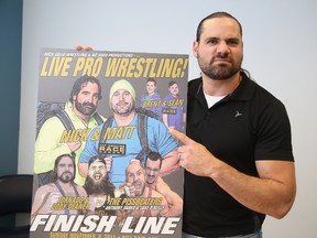 Local wrestler and promoter Mark 'El Tornado' Bartolucci, holds a poster promoting this weekend's show at Lo-Ellen Park Secondary, that will support several of the south end school's charity initiatives.