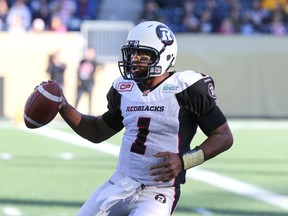 Ottawa RedBlacks QB Henry Burris scrambles during CFL action against the Winnipeg Blue Bombers in Winnipeg on Oct. 24, 2015. (Kevin King/Winnipeg Sun/Postmedia Network)