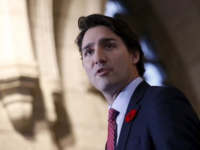 Canada's Prime Minister Justin Trudeau speaks to journalists as he arrives for a Liberal caucus meeting on Parliament Hill in Ottawa, Canada, November 5, 2015. REUTERS/Chris Wattie