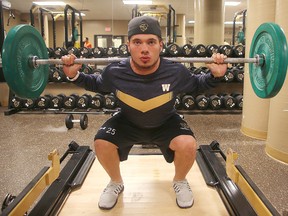 Bisons linebacker DJ Lalama hits the weights as the team prepares for a weekend clash with the UBC T-Birds.