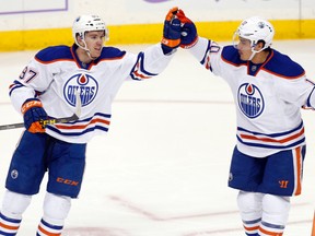 Connor McDavid and Nail Yakupov celebrate after a goal earlier this season. (AP Photo)
