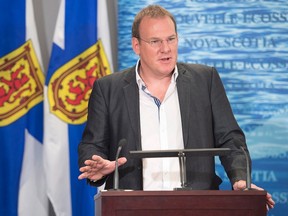 Environment Minister Andrew Younger fields questions about his failure to appear in provincial court for an assault case, at a news conference in Halifax on Thursday, Nov. 5, 2015. Younger said he didn't attend because he was not asked to waive a legislative privilege that prevented him from testifying in a criminal matter. THE CANADIAN PRESS/Andrew Vaughan