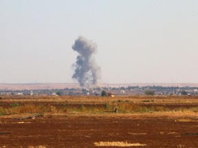 A picture taken on September 1, 2015 shows smoke billowing on the outskirts of Marea in the northern Syrian Aleppo district during fighting between opposition fighters and Islamic State (IS) group. Marea is the main rebel stronghold in Aleppo that has been under fierce IS attack for months and is now completely encircled by the jihadists. AFP PHOTO / ZAKARIYA AL-KAFI