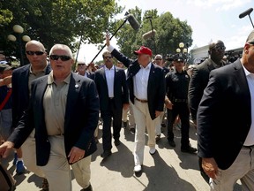 U.S. Republican presidential candidate Donald Trump is surrounded by security as he greets attendees at the Iowa State Fair during a campaign stop in Des Moines, Iowa, United States, in an August 15, 2015 file photo. The Department of Homeland Security has authorized U.S. Secret Service protection for Republican presidential candidates Donald Trump and Ben Carson. REUTERS/Jim Young/Files