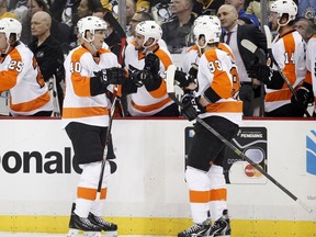 Flyers forward Vincent Lecavalier (40) high-sticked teammate Braydon Schenn during a game against the Flames in Calgary on Thursday night. (Justin K. Aller/Getty Images/AFP/Files)