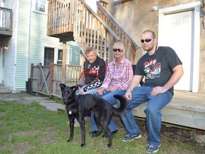 Ron Couillard, left, Linda Terris, and Gilles Couillard — the brother, sister-in-law and nephew of murder victim Marcel Couillard — gather to support one another at their home next-door to the building where Marcel lived on Melvin Avenue. (Jim Moodie/Sudbury Star file photo)