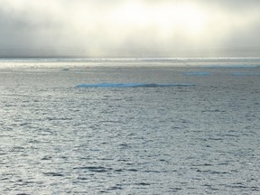 In this September 23, 2015 photo, ice chunks are seen in the Northwest Passage near the CCGS Amundsen, a Canadian research ice-breaker navigating in the Canadian High Arctic. AFP PHOTO / CLEMENT SABOURIN